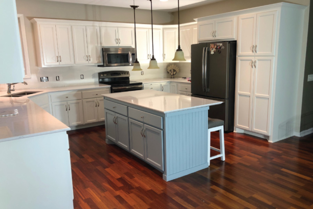 Accented painted island with white cabinet in Lakeville MN