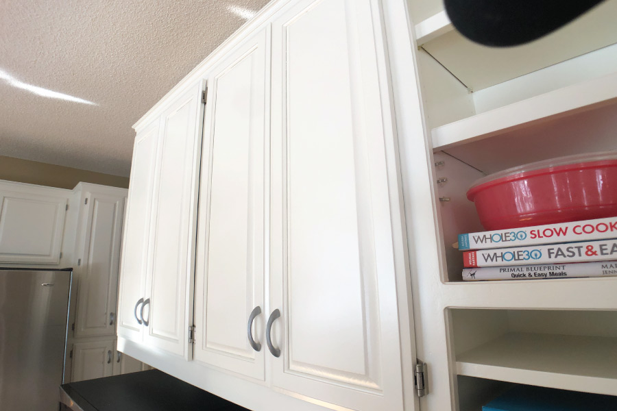 Freshly painted cabinets doors with color Dover White