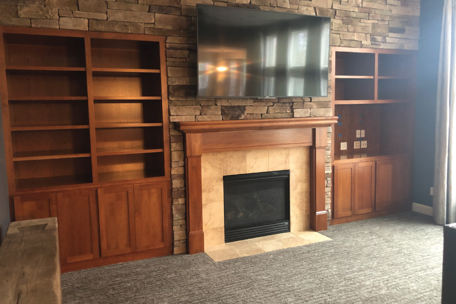 Dark stained maple entertainment built in cabinet