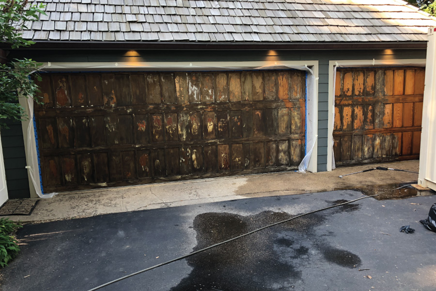 Old worn stain on a wood garage door