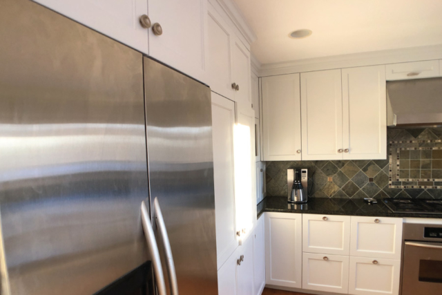 Painted cabinets with built in stainless steel fridge