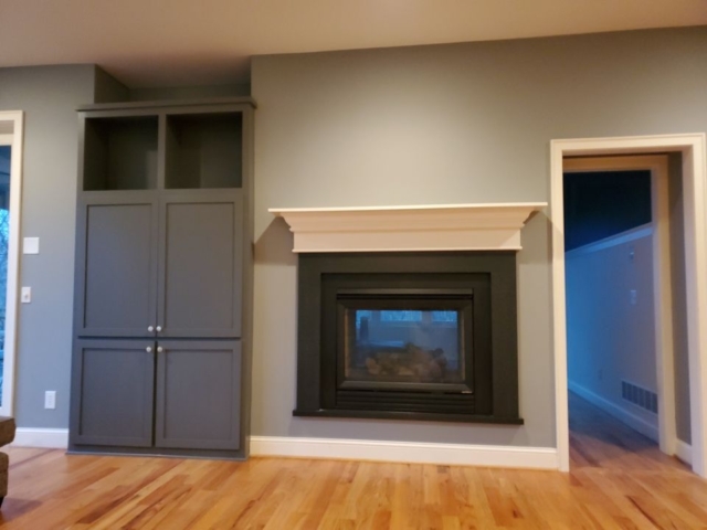 Painted fireplace mantle and entertainment built in