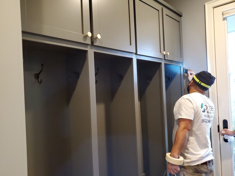 Inspecting and touching up cabinets