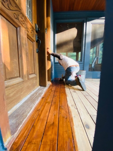 Staining the deck floor with a brush